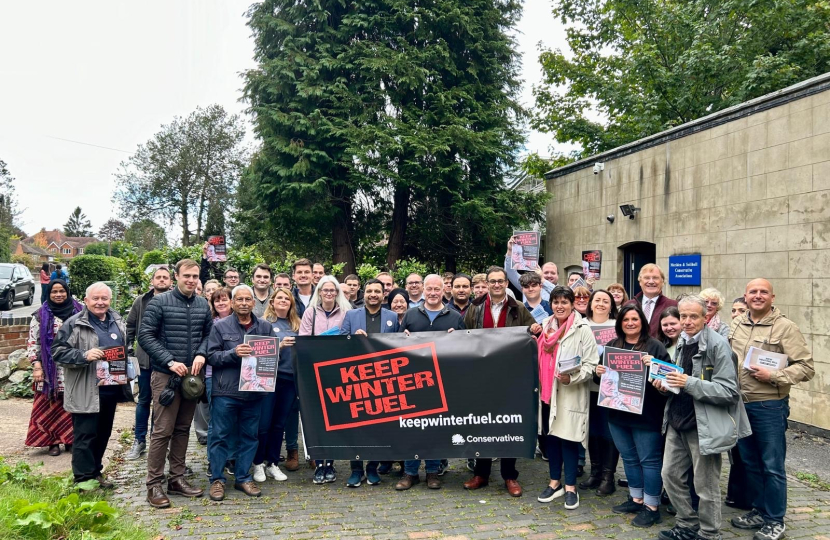 Neil and volunteers campaigning to keep winter fuel