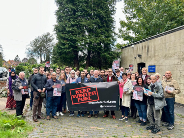 Neil and volunteers campaigning to keep winter fuel