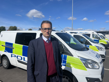 Neil with police vans